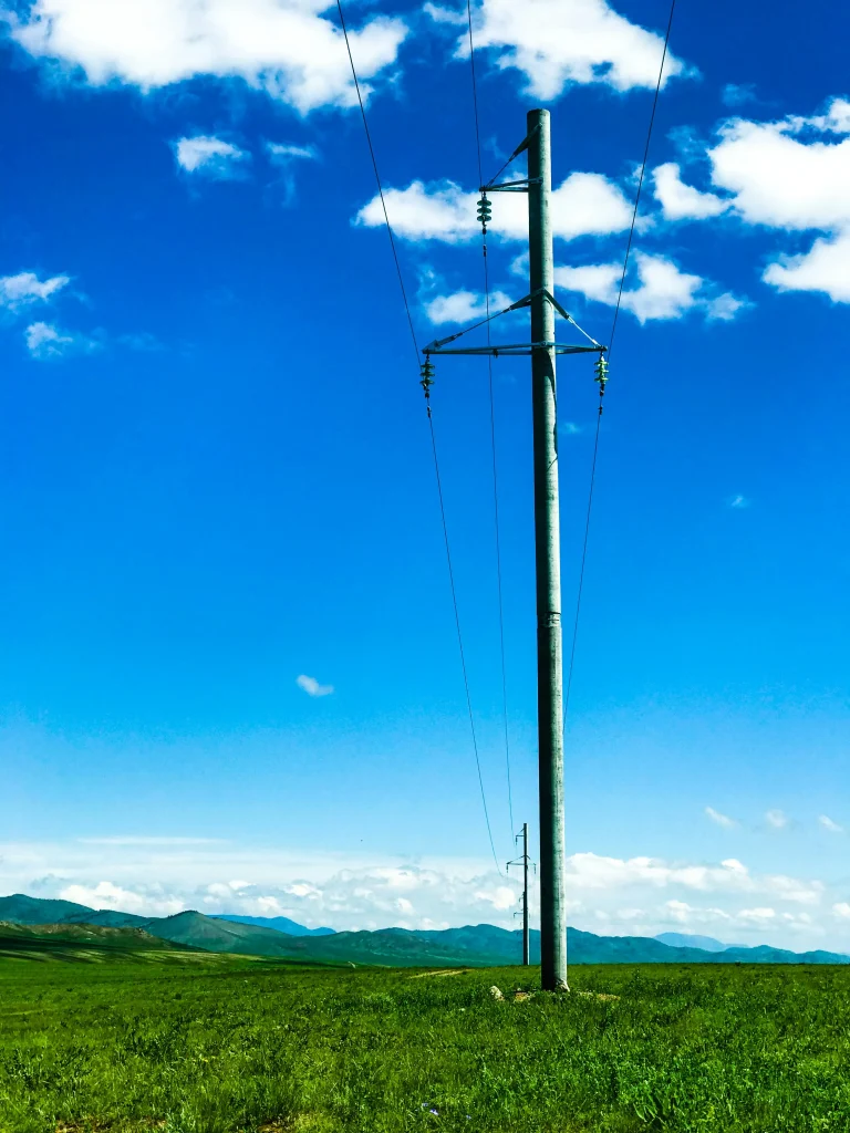 Property Pole Installation in Townsville showing a professionally installed private power pole with overhead lines in a rural or commercial North Queensland setting